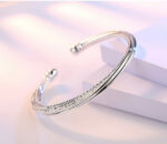 Interlock Silver Bangle - Image 2